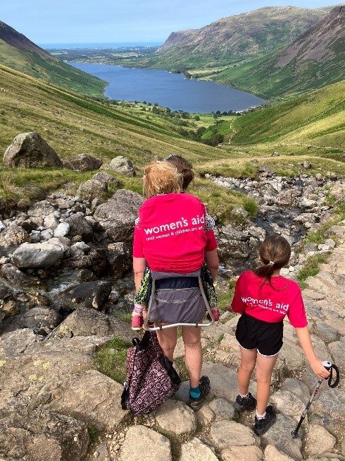 A woman with her two children in the Lake District fundraising for Women's Aid.