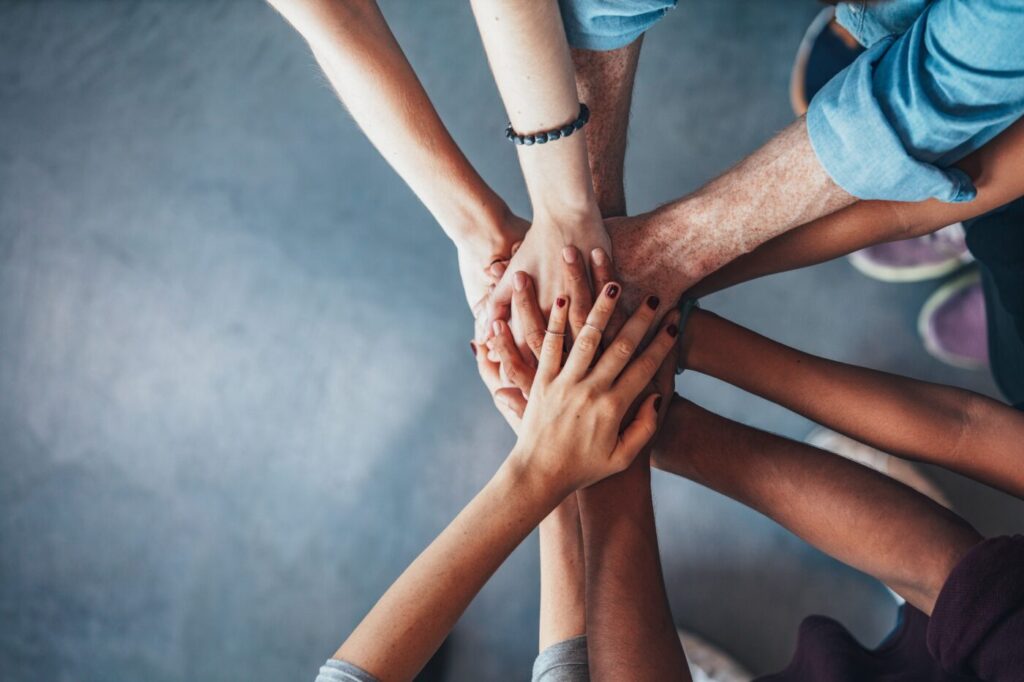 A group of hands one on top of the other