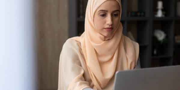 Woman looking at laptop