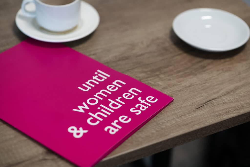 An image of a leaflet that says 'until women and children are safe'