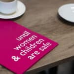 An image of a leaflet that says 'until women and children are safe'