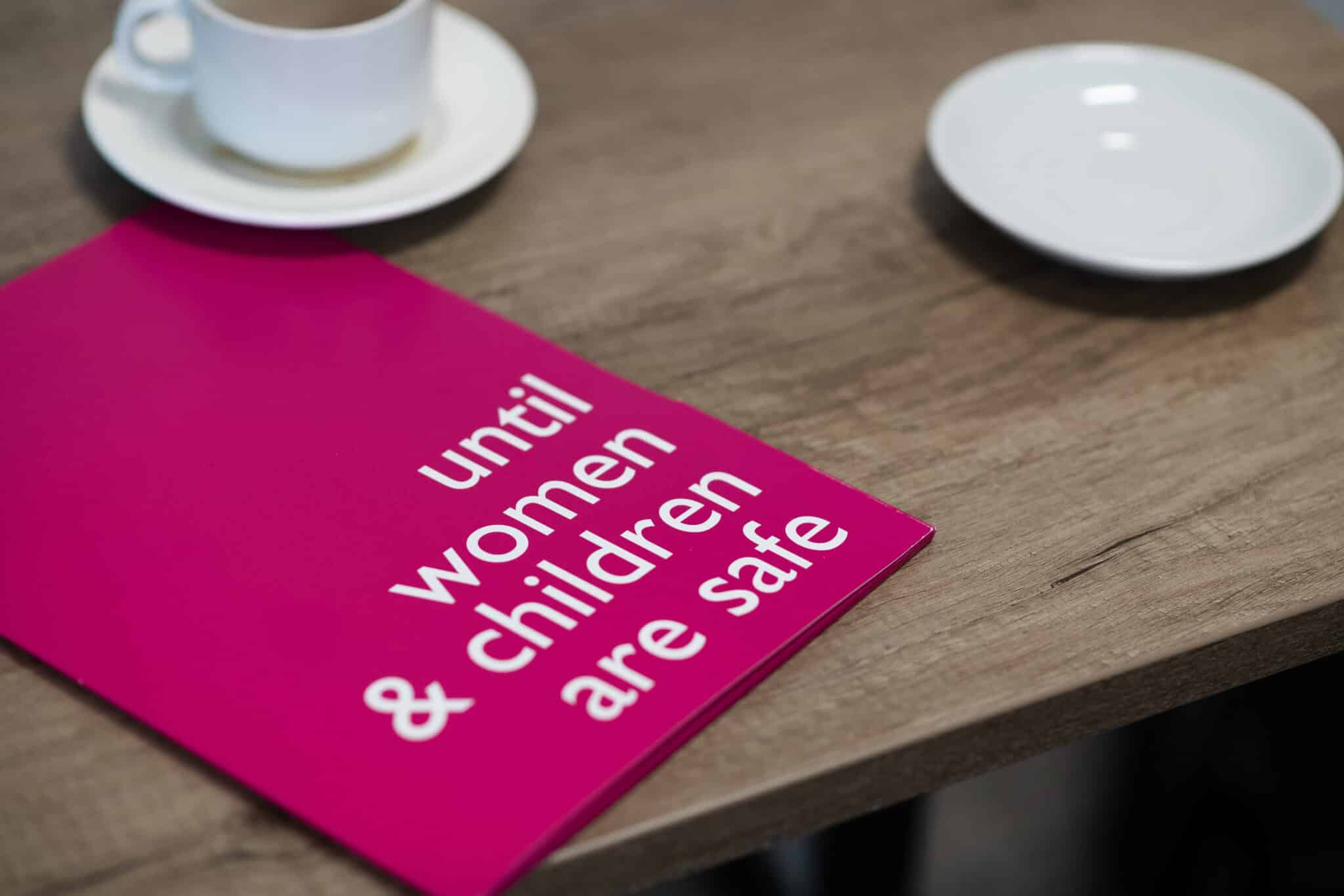 An image of a leaflet that says 'until women and children are safe'