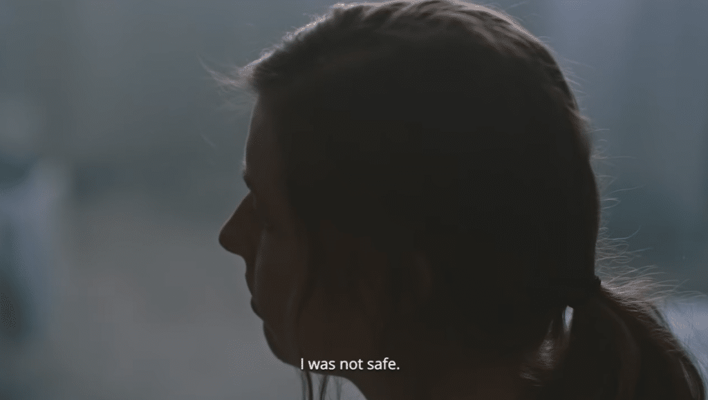 A dark image of a woman and the caption 'I was not safe.'