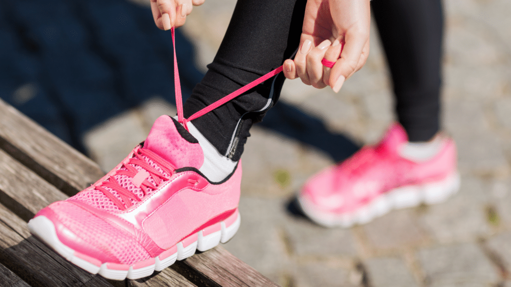 Someone tying their shoes